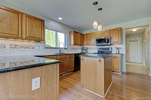 560 Boulder Lake Dr, Oxford, MI 48371 - kitchen featuring appliances with stainless steel finishes, light wood-type flooring, a center island, backsplash, and hanging light fixtures