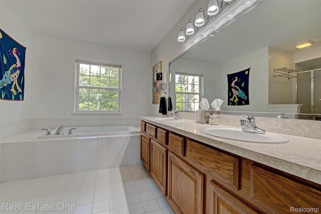 560 Boulder Lake Dr, Oxford, MI 48371 - full bath featuring tile patterned flooring, a bath, double vanity, and healthy amount of natural light