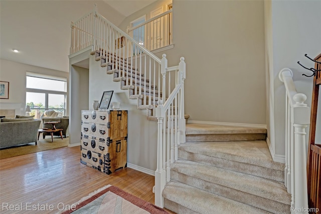 560 Boulder Lake Dr, Oxford, MI 48371 - stairs featuring wood finished floors and baseboards