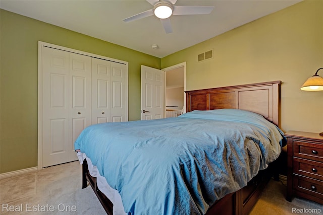 560 Boulder Lake Dr, Oxford, MI 48371 - bedroom featuring light colored carpet, a closet, and a ceiling fan