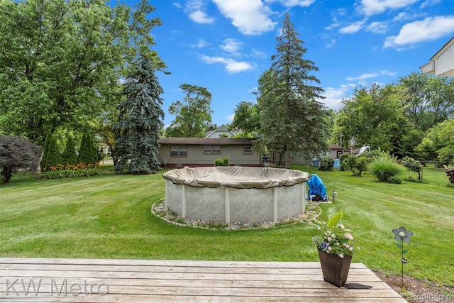 3180 Warringham Ave, Waterford, MI 48329 - view of grassy yard with a wooden deck and a covered pool