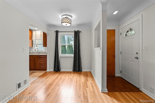 3180 Warringham Ave, Waterford, MI 48329 - entryway featuring light wood-style floors and baseboards