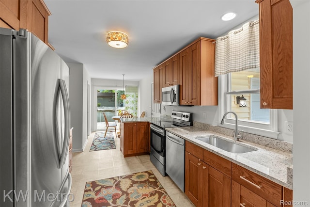 3180 Warringham Ave, Waterford, MI 48329 - kitchen with appliances with stainless steel finishes and brown cabinetry