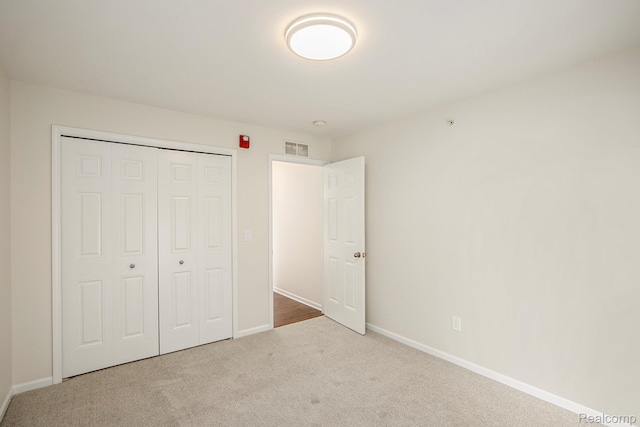 12129 Hidden View Ct, Utica, MI 48315 - unfurnished bedroom featuring carpet floors and a closet