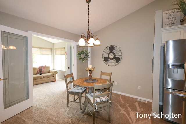 2956 Pebblestone Dr Unit 47, Hudsonville, MI 49426 - carpeted dining area with lofted ceiling and a chandelier
