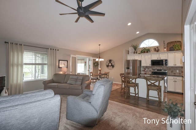2956 Pebblestone Dr Unit 47, Hudsonville, MI 49426 - living area with vaulted ceiling, ceiling fan, recessed lighting, a chandelier, and dark wood finished floors