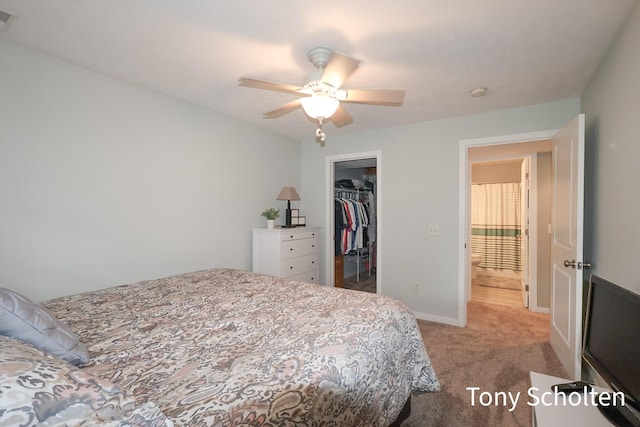 2956 Pebblestone Dr Unit 47, Hudsonville, MI 49426 - bedroom with light colored carpet, a closet, ceiling fan, and a walk in closet