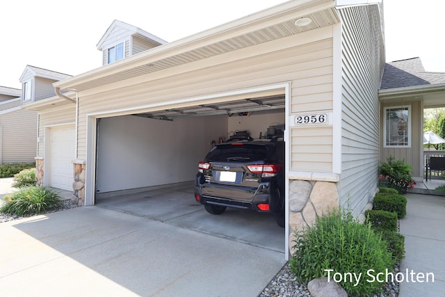 2956 Pebblestone Dr Unit 47, Hudsonville, MI 49426 - garage featuring concrete driveway