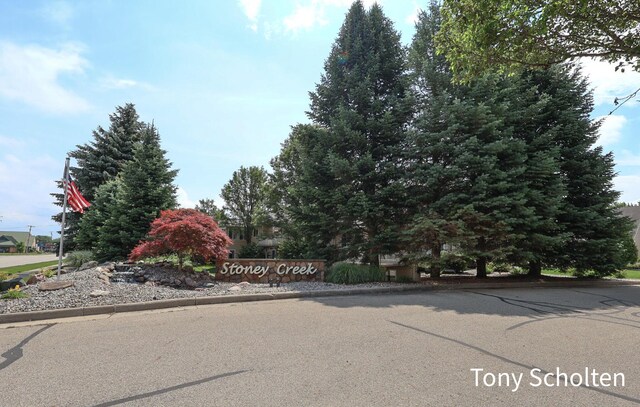 2956 Pebblestone Dr Unit 47, Hudsonville, MI 49426 - view of asphalt street featuring curbs