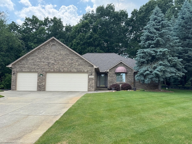 70173 Hillside Ct, Romeo, MI 48065 - ranch-style house featuring concrete driveway, an attached garage, a front yard, and brick siding