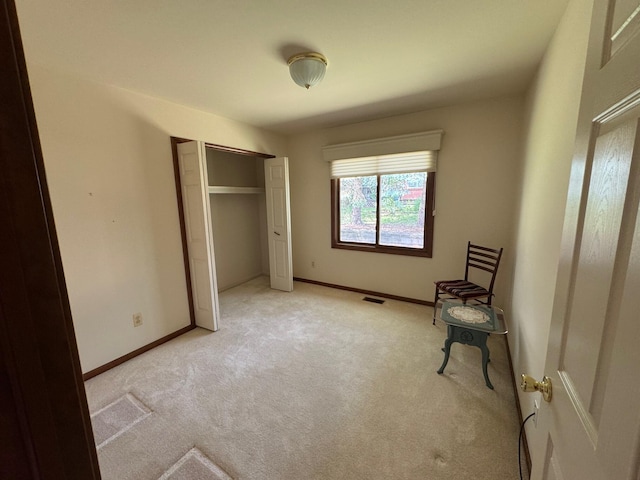 70173 Hillside Ct, Romeo, MI 48065 - unfurnished bedroom featuring light colored carpet and a closet
