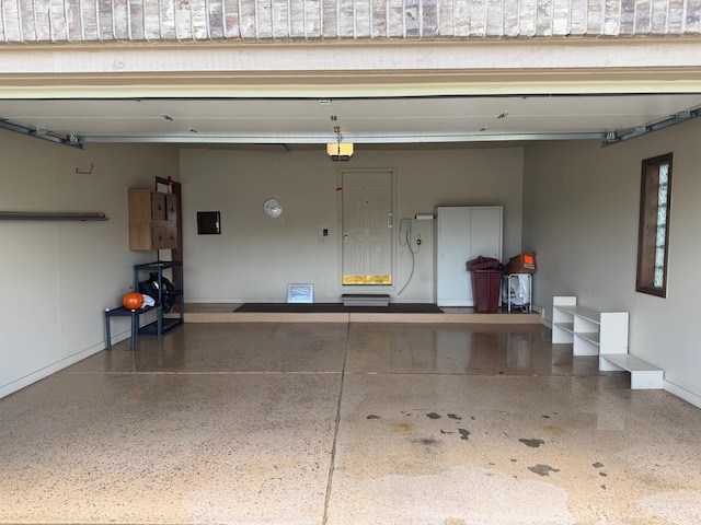 70173 Hillside Ct, Romeo, MI 48065 - garage with a garage door opener and baseboards