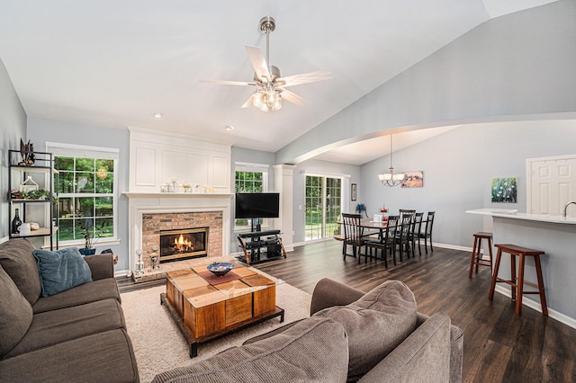 8191 Creekside Dr, Westland, MI 48185 - living area with lofted ceiling, arched walkways, healthy amount of natural light, a ceiling fan, and dark wood-style flooring