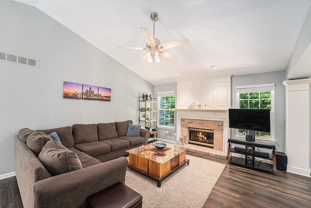 8191 Creekside Dr, Westland, MI 48185 - living area featuring dark wood finished floors, a ceiling fan, a brick fireplace, recessed lighting, and high vaulted ceiling