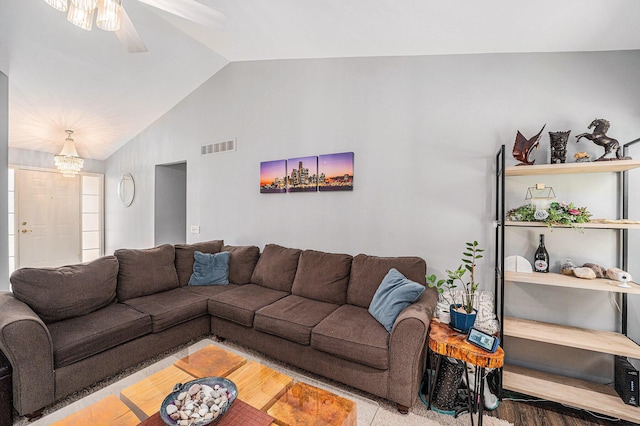 8191 Creekside Dr, Westland, MI 48185 - living area featuring vaulted ceiling, a ceiling fan, and a chandelier