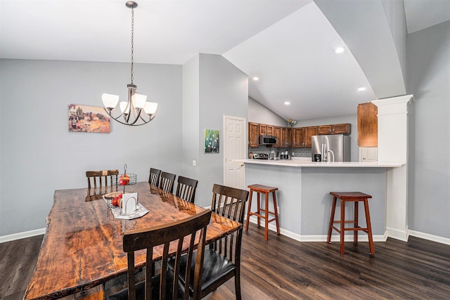 8191 Creekside Dr, Westland, MI 48185 - dining space with dark wood-type flooring, a chandelier, vaulted ceiling, and recessed lighting
