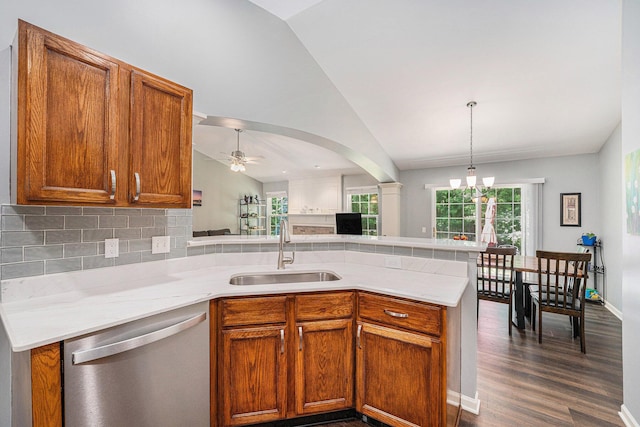 8191 Creekside Dr, Westland, MI 48185 - kitchen featuring stainless steel dishwasher, vaulted ceiling, a peninsula, light countertops, and ceiling fan