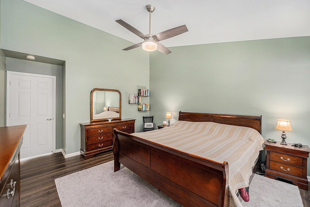 8191 Creekside Dr, Westland, MI 48185 - bedroom with dark wood-style flooring, vaulted ceiling, and a ceiling fan