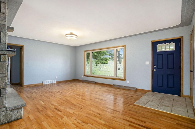 8520 Pennfield Rd, Battle Creek, MI 49017 - entrance foyer featuring wood finished floors and ornate columns