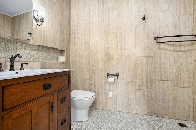 8520 Pennfield Rd, Battle Creek, MI 49017 - bathroom with vanity, tile patterned floors, and tasteful backsplash
