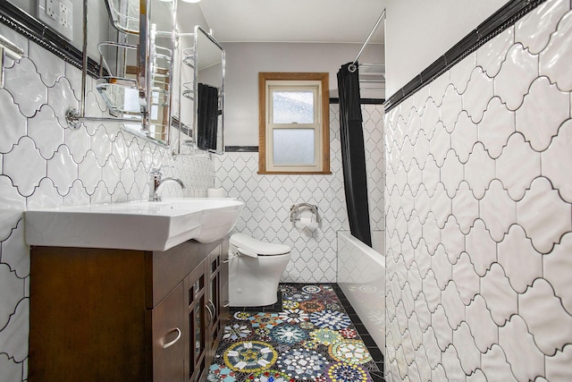 8520 Pennfield Rd, Battle Creek, MI 49017 - full bathroom with vanity, shower / bathtub combination with curtain, tile patterned floors, tile walls, and a wainscoted wall