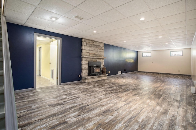 8520 Pennfield Rd, Battle Creek, MI 49017 - unfurnished living room with wood finished floors, a drop ceiling, a fireplace, and recessed lighting