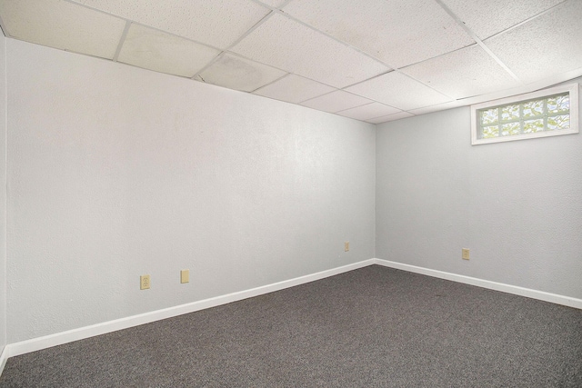 8520 Pennfield Rd, Battle Creek, MI 49017 - spare room featuring a paneled ceiling and dark carpet