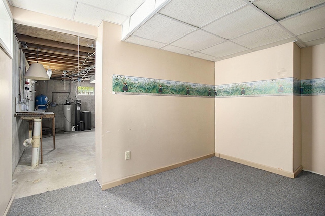 8520 Pennfield Rd, Battle Creek, MI 49017 - unfinished below grade area with a water softener, a paneled ceiling, and carpet floors