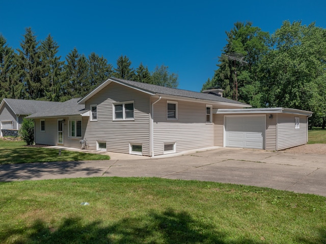 4409 E T U Ave, Vicksburg, MI 49097 - view of front of property featuring concrete driveway, a front yard, and an outbuilding