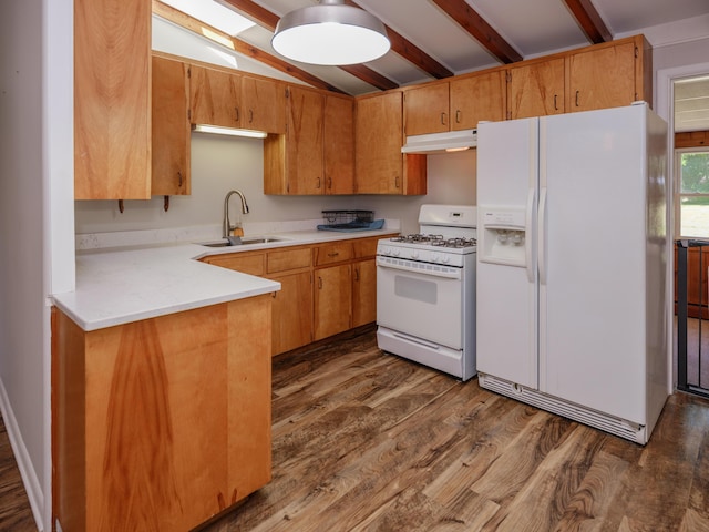 4409 E T U Ave, Vicksburg, MI 49097 - kitchen with white appliances, under cabinet range hood, light countertops, and dark wood-style flooring