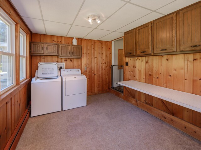 4409 E T U Ave, Vicksburg, MI 49097 - laundry room featuring cabinet space, baseboard heating, separate washer and dryer, wood walls, and light carpet