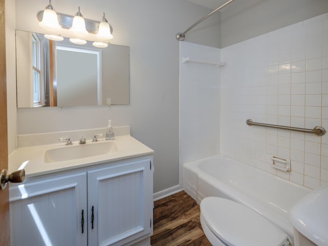 4409 E T U Ave, Vicksburg, MI 49097 - bathroom featuring wood finished floors, tub / shower combination, and vanity