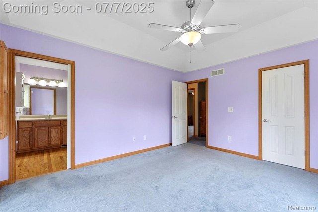 22069 Inkster Rd, Flat Rock, MI 48174 - unfurnished bedroom featuring light carpet, connected bathroom, and ceiling fan