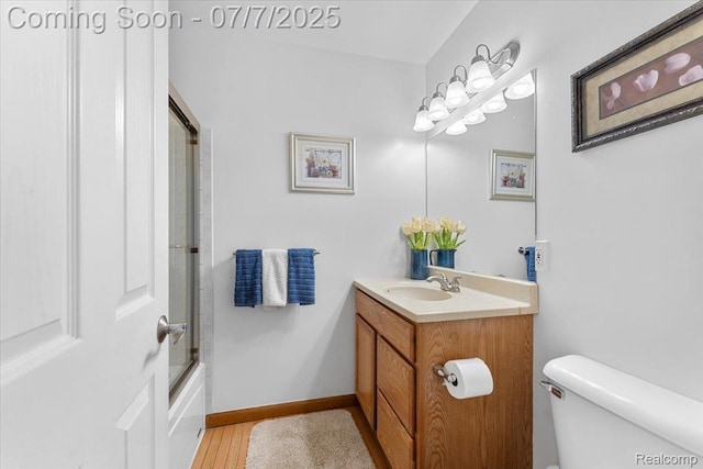 22069 Inkster Rd, Flat Rock, MI 48174 - bathroom with vanity, bath / shower combo with glass door, and wood finished floors