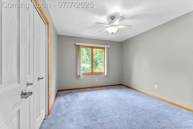 22069 Inkster Rd, Flat Rock, MI 48174 - carpeted spare room featuring baseboards and a ceiling fan