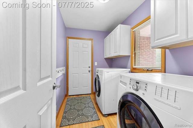 22069 Inkster Rd, Flat Rock, MI 48174 - laundry room with cabinet space, washing machine and dryer, and light wood-style flooring
