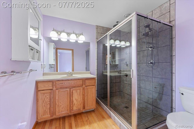 22069 Inkster Rd, Flat Rock, MI 48174 - bathroom with wood finished floors, vanity, and a shower stall