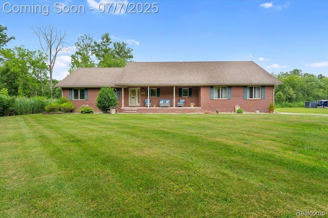 22069 Inkster Rd, Flat Rock, MI 48174 - ranch-style home with a porch, a front lawn, and brick siding