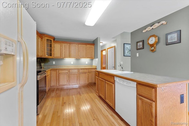 22069 Inkster Rd, Flat Rock, MI 48174 - kitchen featuring white appliances, light wood-style flooring, glass insert cabinets, light countertops, and a kitchen island