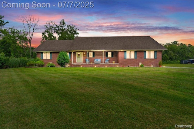 22069 Inkster Rd, Flat Rock, MI 48174 - ranch-style home featuring a front yard, a porch, and brick siding
