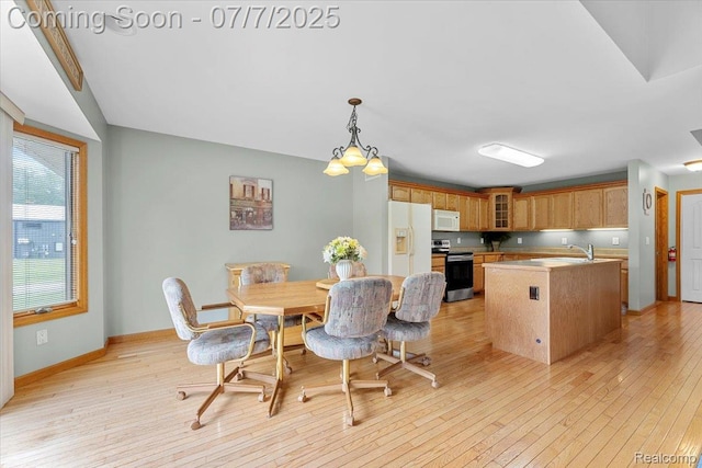 22069 Inkster Rd, Flat Rock, MI 48174 - dining area featuring light wood-style floors and baseboards