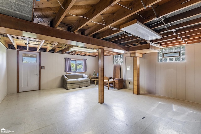 331 S St, Ortonville, MI 48462 - below grade area with tile patterned floors and wooden walls