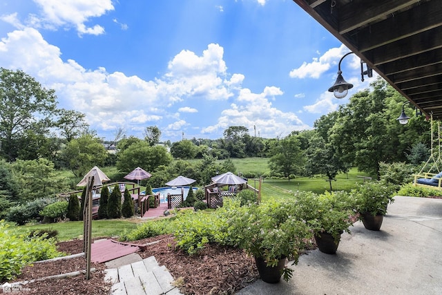 331 S St, Ortonville, MI 48462 - view of green lawn with a deck
