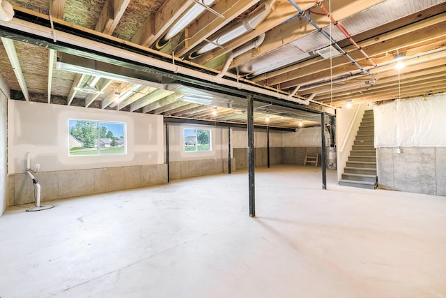 5391 Swan Ln, Burton, MI 48509 - below grade area featuring drainage system and stairs