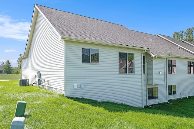5391 Swan Ln, Burton, MI 48509 - view of side of property with a yard and a shingled roof
