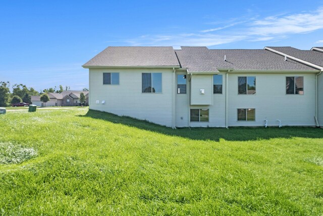 5391 Swan Ln, Burton, MI 48509 - rear view of house featuring a yard