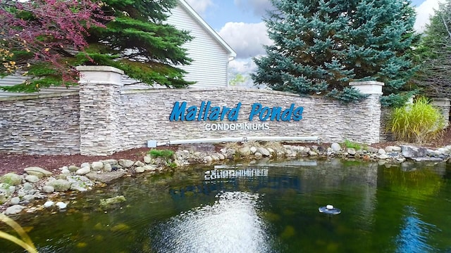 5391 Swan Ln, Burton, MI 48509 - community / neighborhood sign featuring a water view