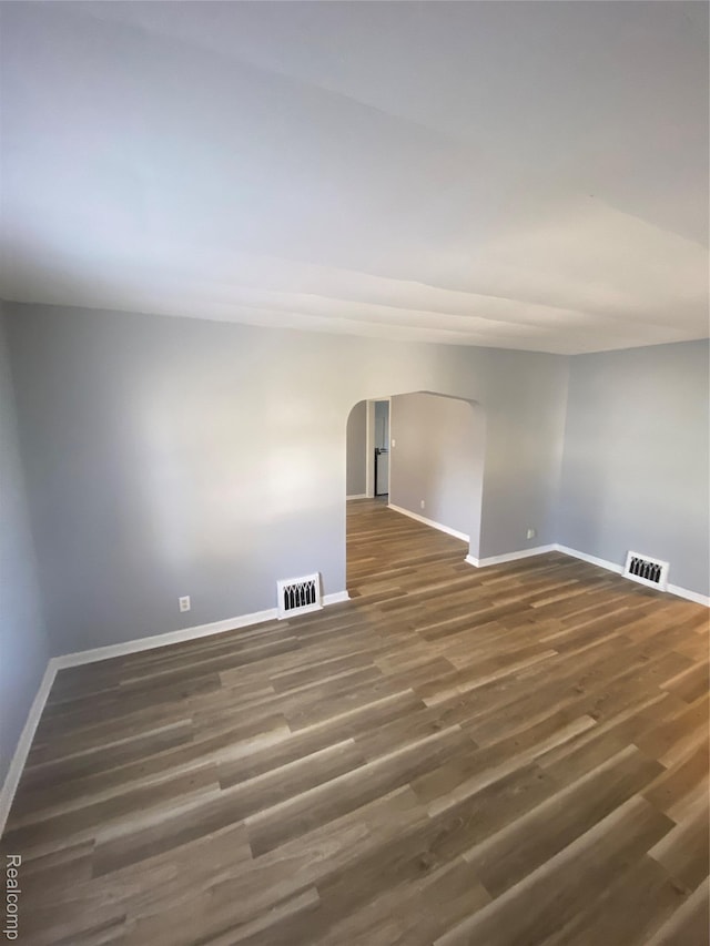 1112 Minnie St, Port Huron, MI 48060 - unfurnished room featuring wood finished floors and arched walkways