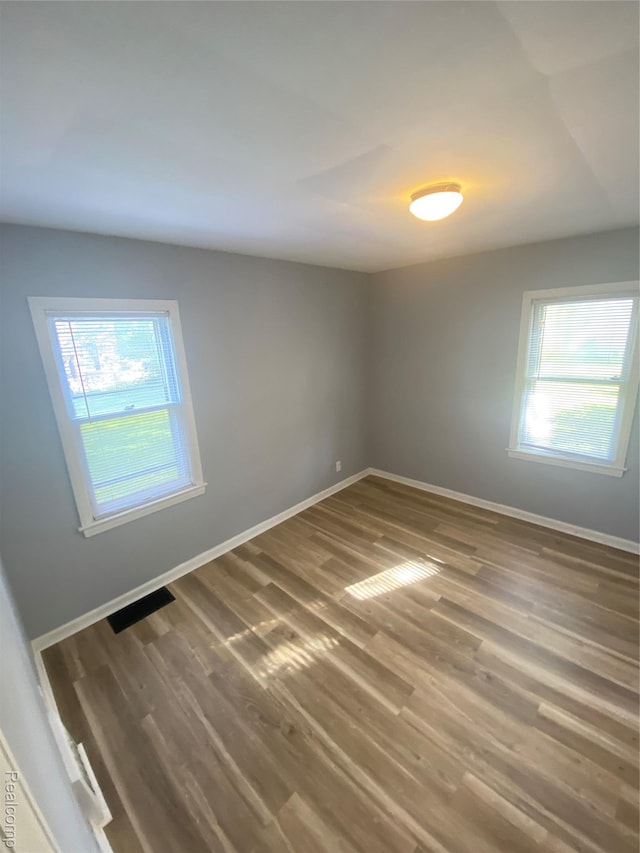 1112 Minnie St, Port Huron, MI 48060 - unfurnished room with wood finished floors and baseboards