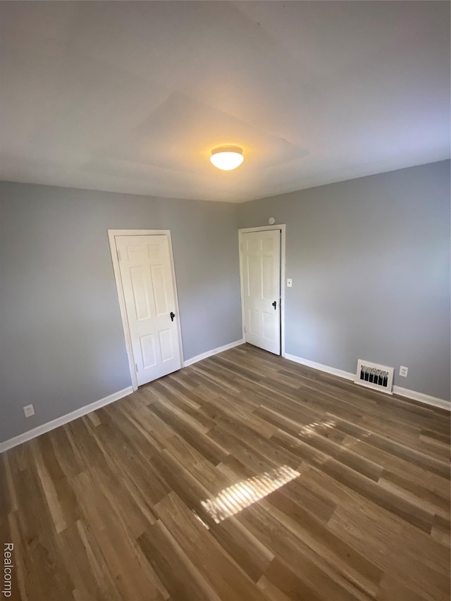 1112 Minnie St, Port Huron, MI 48060 - spare room with baseboards and wood finished floors